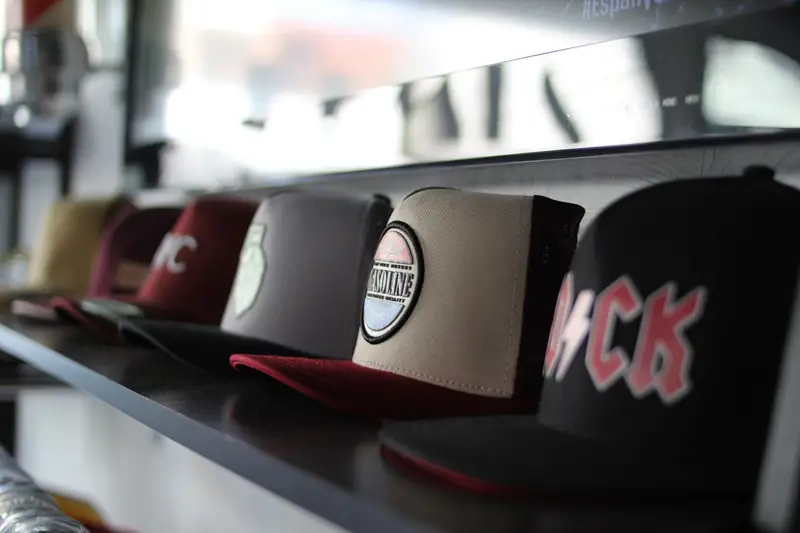Row of caps on a shop shelf