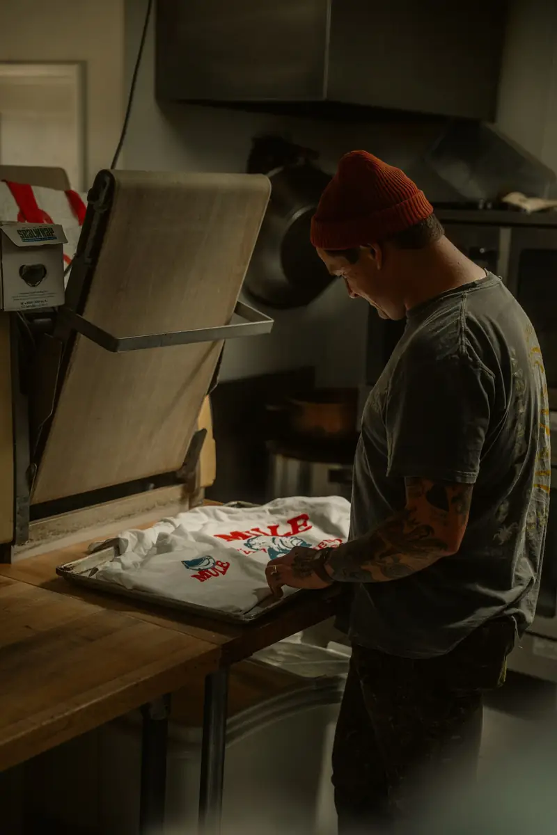 Printer pressing a custom design onto a T-shirt
