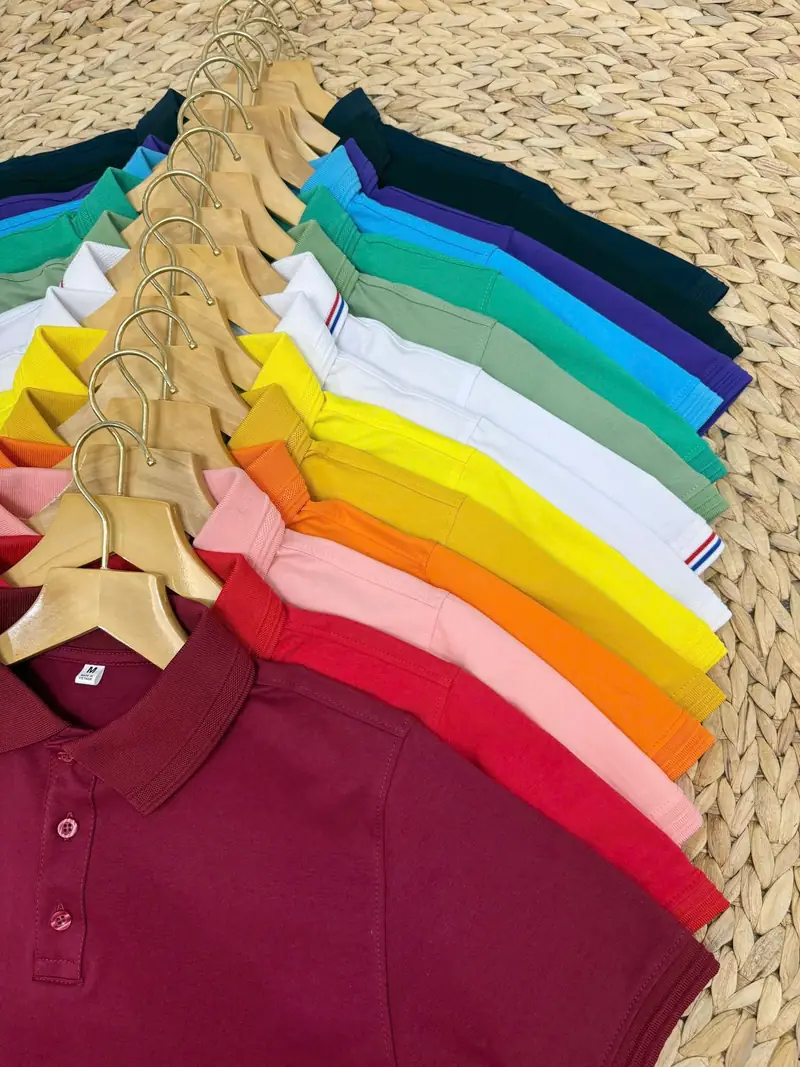 Rack of polo shirts in a range of colours